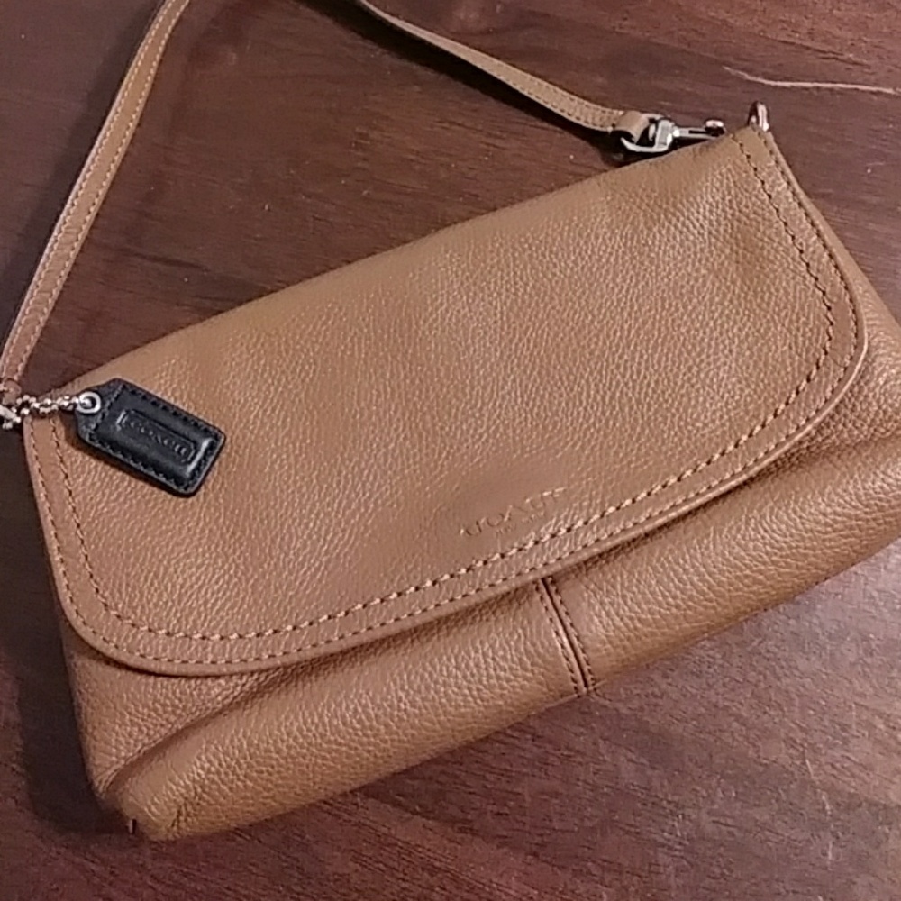 Brown Vintage Coach wristlet.